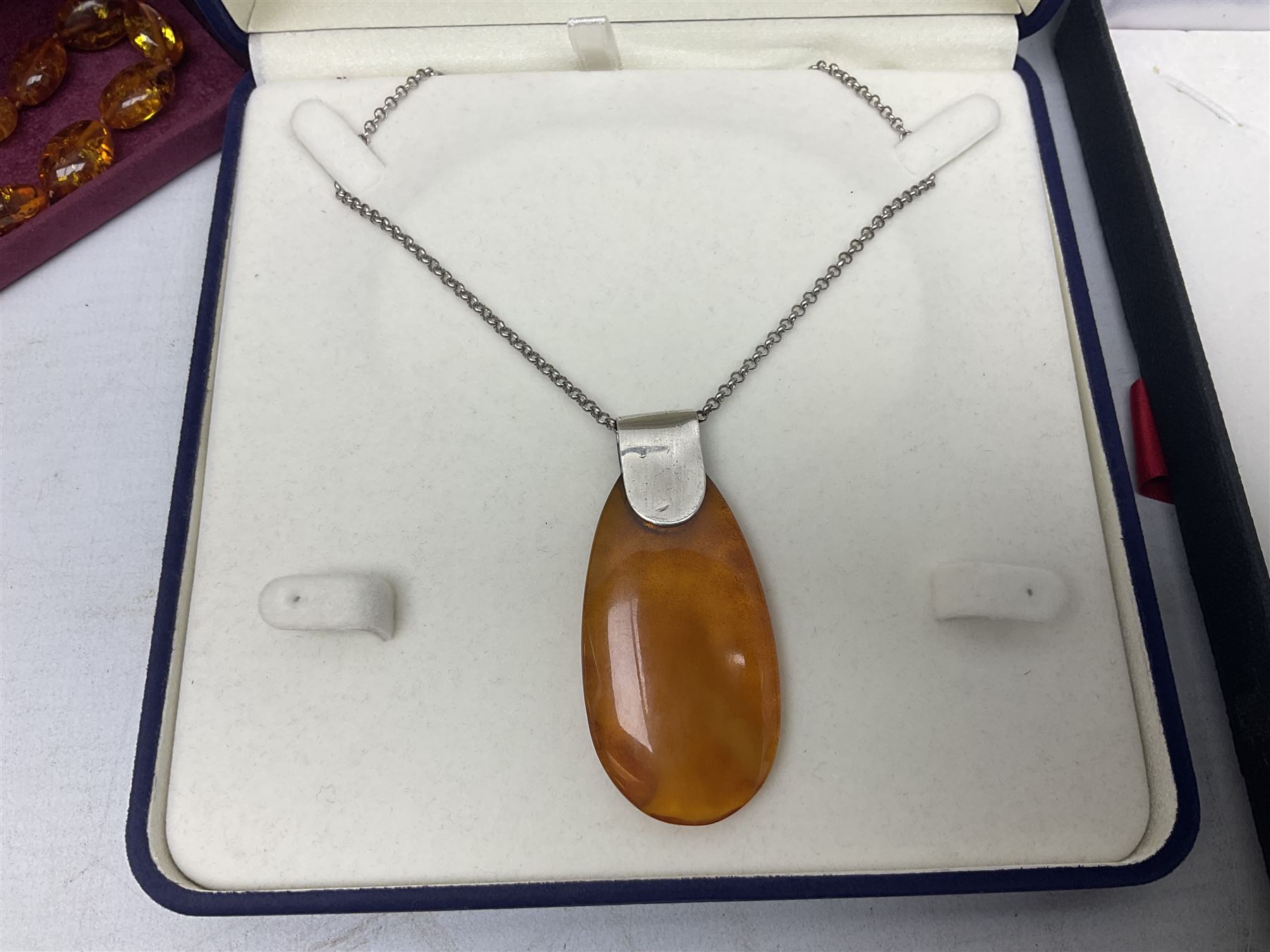 Silver-gilt drip design Lucy Q necklace, designed by Lucy Quartermaine, amber necklaces, silver-gilt stone set heart pendant, 10ct gold single stone set stud earrings, silver interchangeable pearl hoop earrings and a collection of costume jewellery and wristwatches 