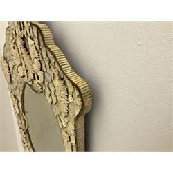 Pair 19th century French Dieppe bone and ivory wall mirrors, the oval bevelled mirror plates within rectangular frames with shaped tops, profusely decorated with ivory leaves, further detailed with carved bone armorial type crest inscribed 'SGOTORVM', putti, fish and mask heads, H81cm W48cm