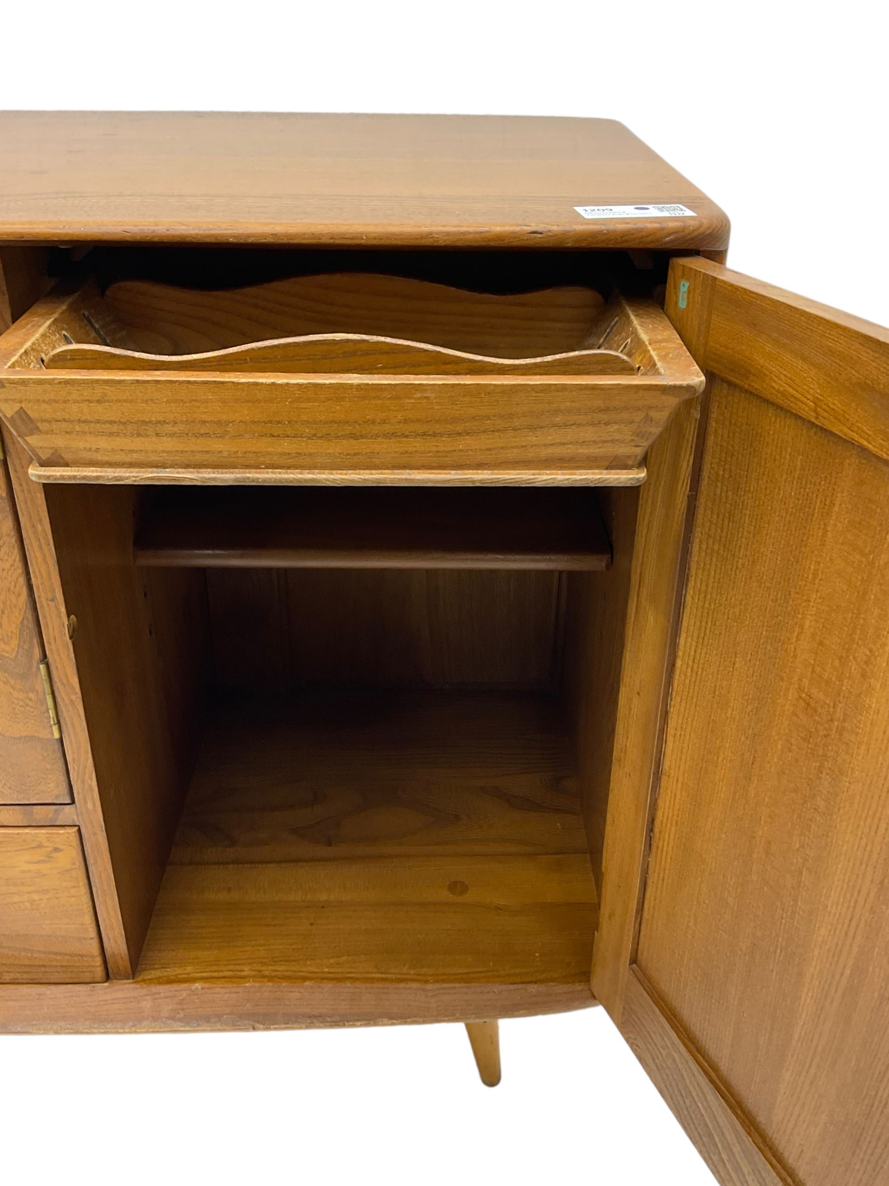 Ercol - elm and beech sideboard, fitted with cupboards and single drawer, enclosed by panelled doors, on splayed tapering feet