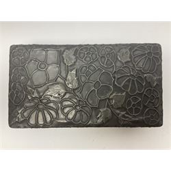 Liberty & Co Tudric pewter cigarette box, of plain rectangular form, with planished decoration to the slightly domed cover, opening to reveal a softwood interior, stamped Made in England 01234 Tudric Solkets beneath, together with another cigarette box, with applied pewter panels repousse decorated throughout with flower heads and leaves, with compartmentalised softwood interior, largest H5.5cm, W23cm
