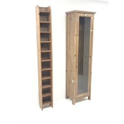  Pine display cabinet, single door enclosing four shelves, stile supports (W52cm, H191cm, D36cm) and a pine CD rack (W25cm, H198cm, D18cm) (2)  