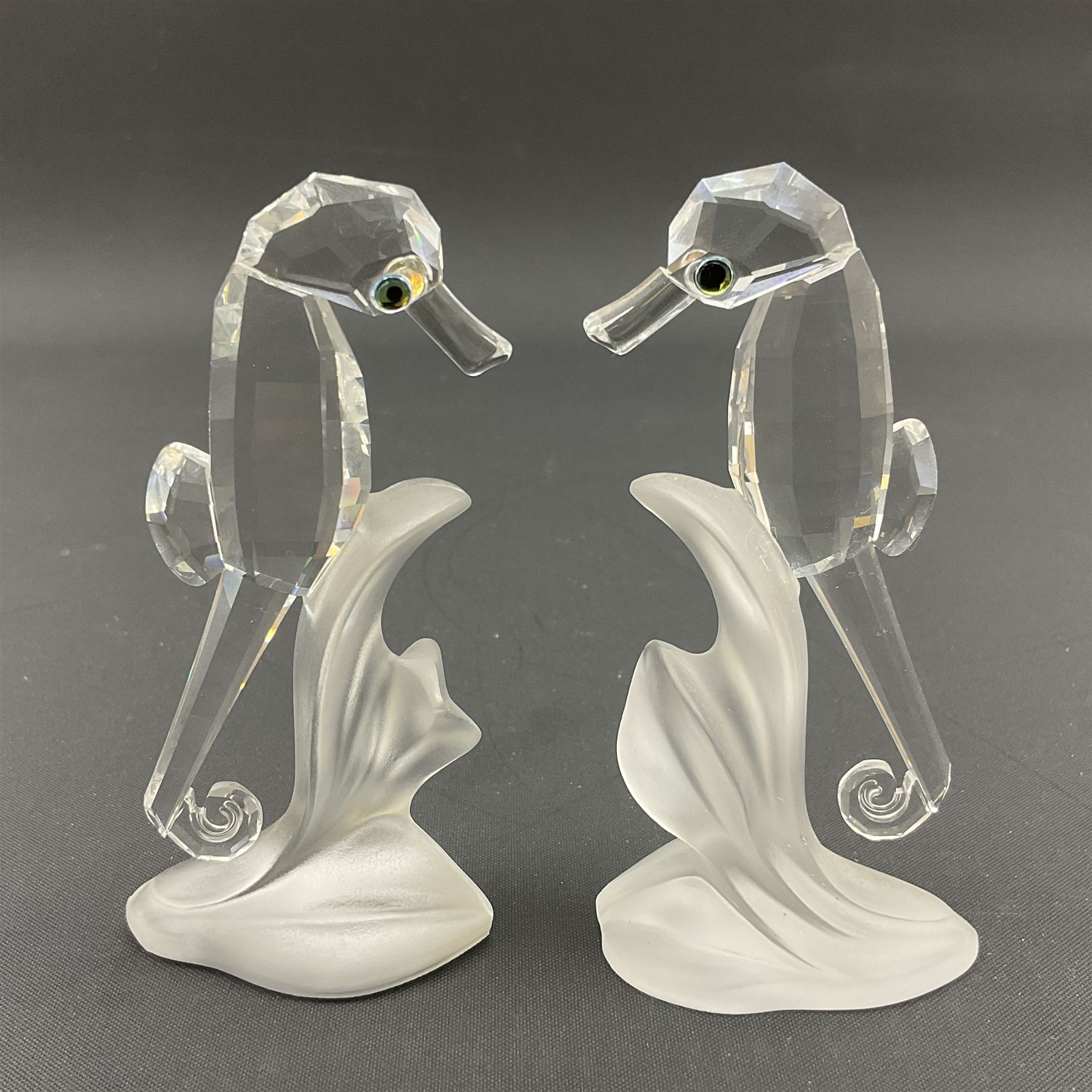 Swarovski Crystal sea creatures, comprising lion fish and dolphin, both with coloured elements, together with two seahorses, two small fish groups, butterfly fish, longnose butterfly fish and six coloured shells, tallest H8.5cm