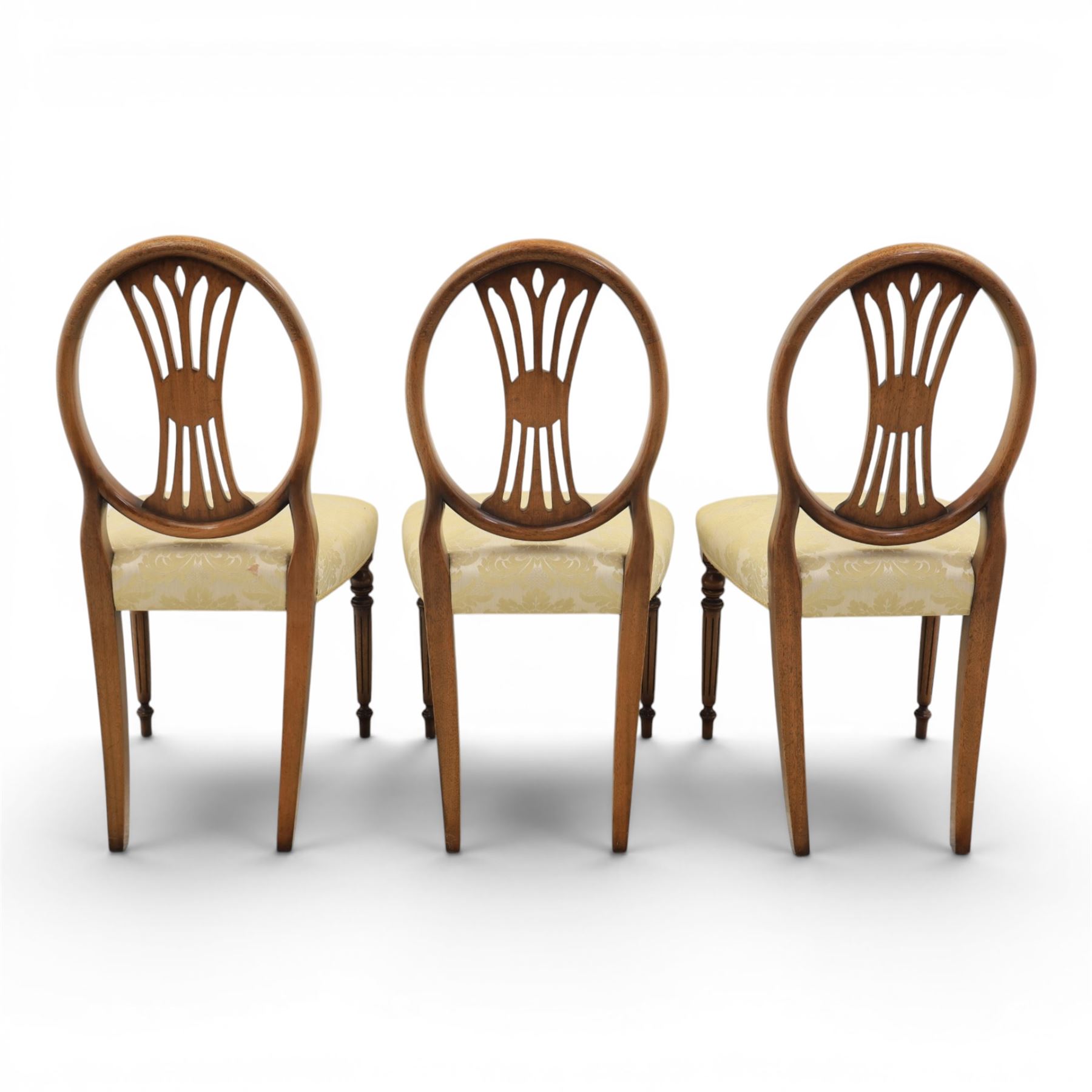 Bevan Funnell Reprodux - Regency design set of ten mahogany dining chairs, oval backs with central splat with rose motif, serpentine seat upholstered in damask fabric, raised on turned supports