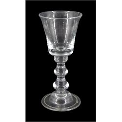 18th century drinking glass, the bucket shaped bowl upon a tripple knopped stem and domed folded foot, H16cm