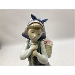 Three Lladro figures, comprising Pondering, no 5173, Nostalgia, no 5071 and Nature's Bounty, no 1417, all with original boxes, largest example H27cm