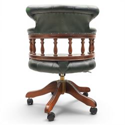 Captains swivel desk chair upholstered in buttoned green leather, five point star base raised on castors