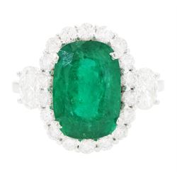 18ct white gold emerald and diamond cluster ring, single cushion cut emerald of approx 2.4...