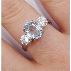 18ct white gold oval aquamarine and round brilliant cut diamond, three stone ring, hallmarked, aquamarine approx 1.25 carat, diamond total weight approx 0.70 carat