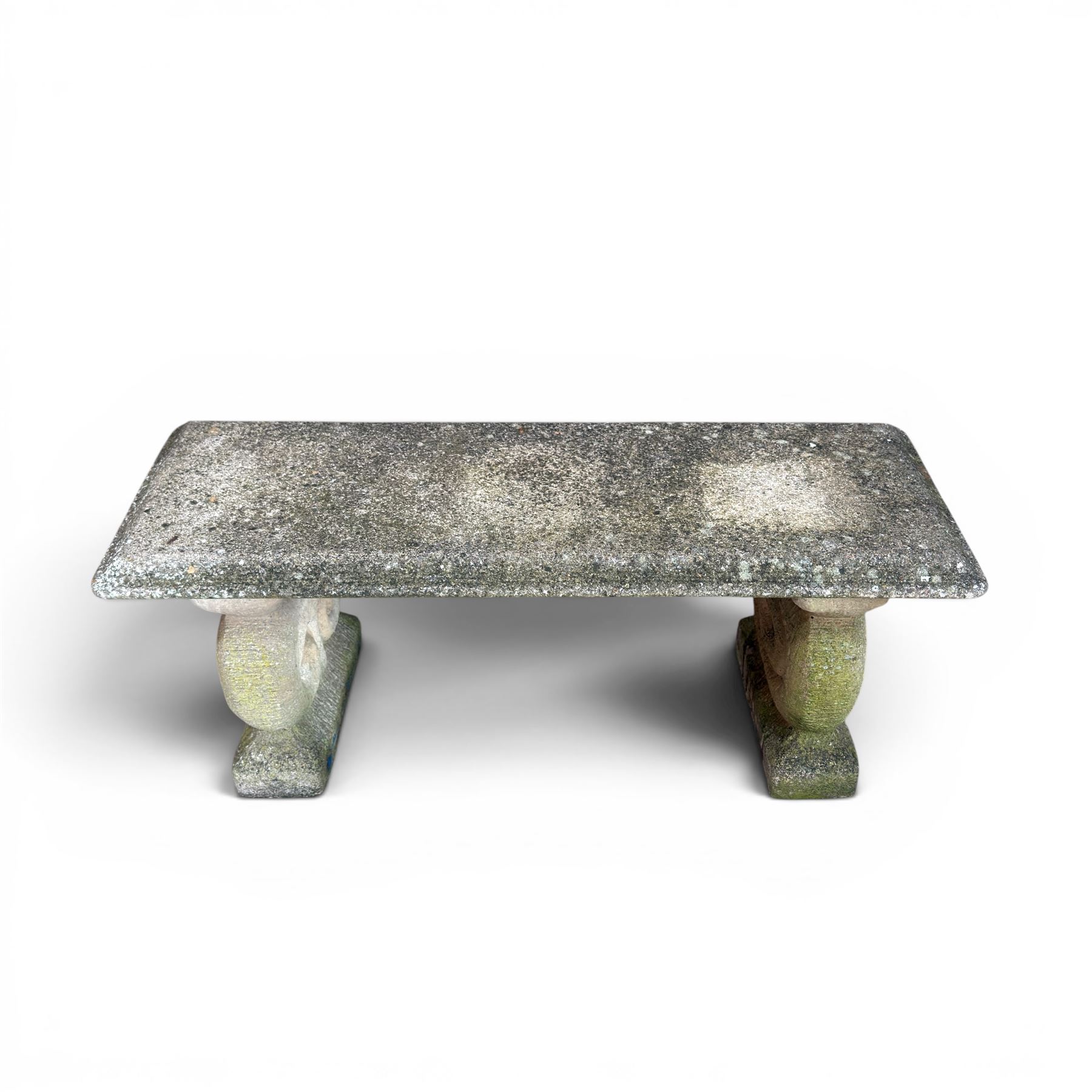 Three piece weathered cast stone garden bench, rectangular top on rounded detailed base