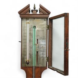 Stampa- George III early 19th-century mercury stick barometer in a mahogany case with a broken pediment and round base, case with chequered inlay to the edge and cistern cover, visible full length bulb cistern tube recording barometric air pressure from 27 to 31 inches with predictions, rectangular silvered register and vernier, with a spirit thermometer indicating the temperature in degrees Fahrenheit.
Mercury present in good condition.
Stampa is recorded as working in London as a barometer and looking glass manufacturer.