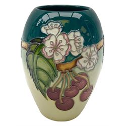 Moorcroft vase, of ovoid form, decorated in the Cherries pattern designed by DJ Hancock, with impressed and painted marks beneath, including date symbol for 1999, H13cm. 