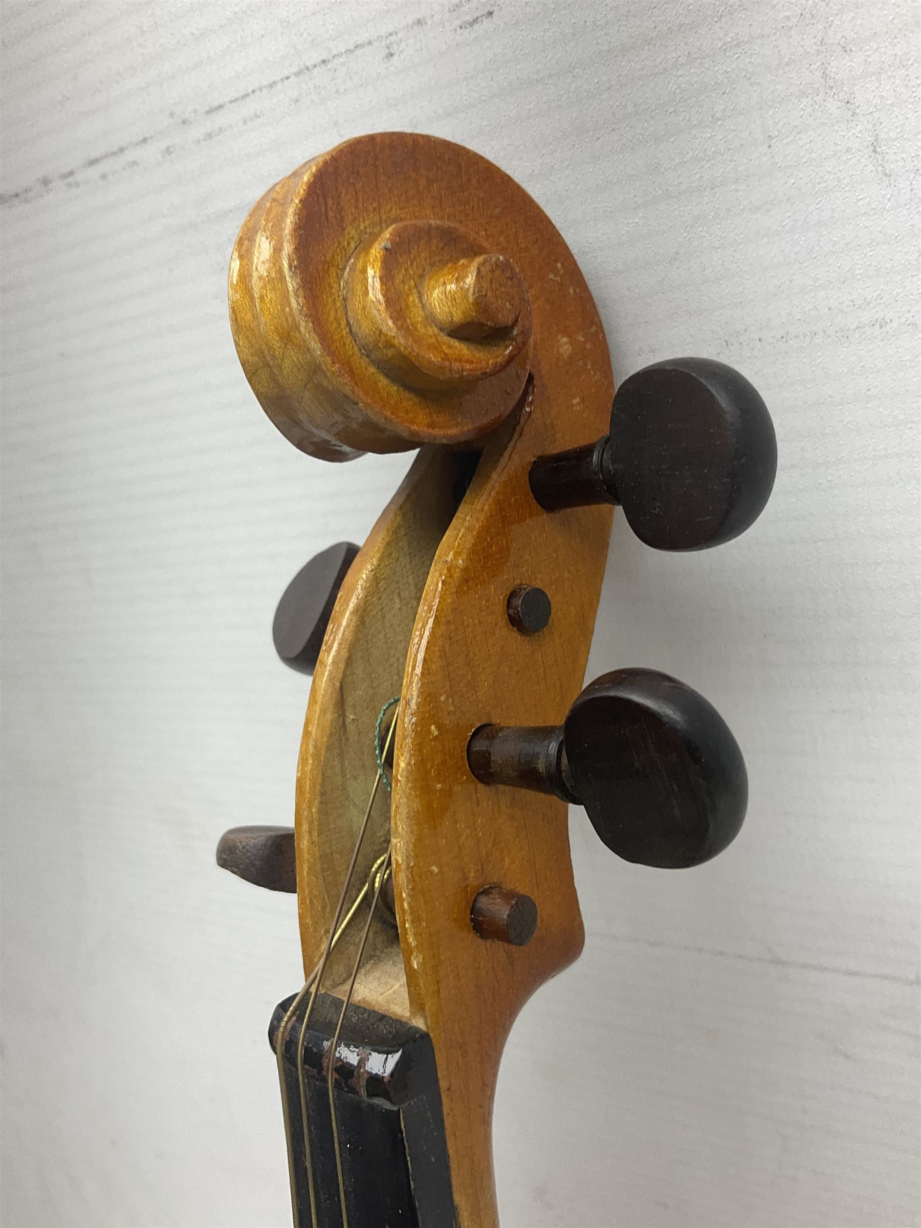 Four Chinese graduated violins - full size with 35.5cm two-piece back; three-quarter size with 33.5cm two-piece back; half size with 31cm two-piece back; and quarter size with 27.5cm two-piece back; all cased except full size; one with bow (4)
