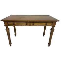 19th century walnut side table, rectangular top over two drawers with elm facias, lobe carved handles and moulded edge in mahogany, on turned and fluted supports 