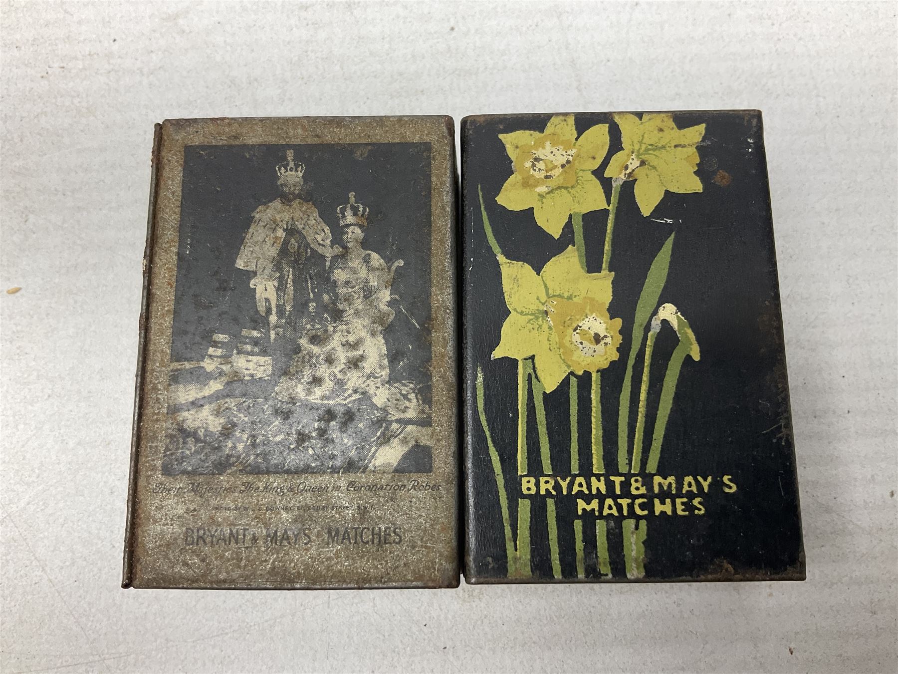 Victorian leather cigar protector with metal match striking plate on the end and internal spring to hold the cigars in place; expands for differing lengths of cigar, minimum L12.5cm; another similar leather cigar case marked Middlemore's Patent with attached vesta case and striker; three Bryant & Mays tin-late matchbox holders including 1935 Jubilee; and small box of matches (6)