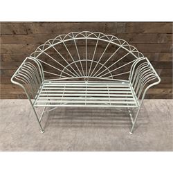 Wrought metal two seat garden bench, sunburst back, painted in pale green finish