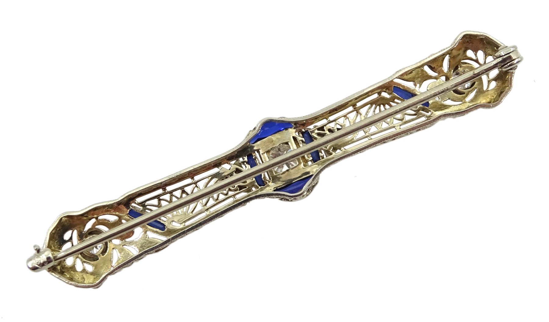 Art Deco platinum diamond and vari-cut synthetic sapphire bar open work brooch, in Charles Packer & Co Ltd, Regents Street, London box