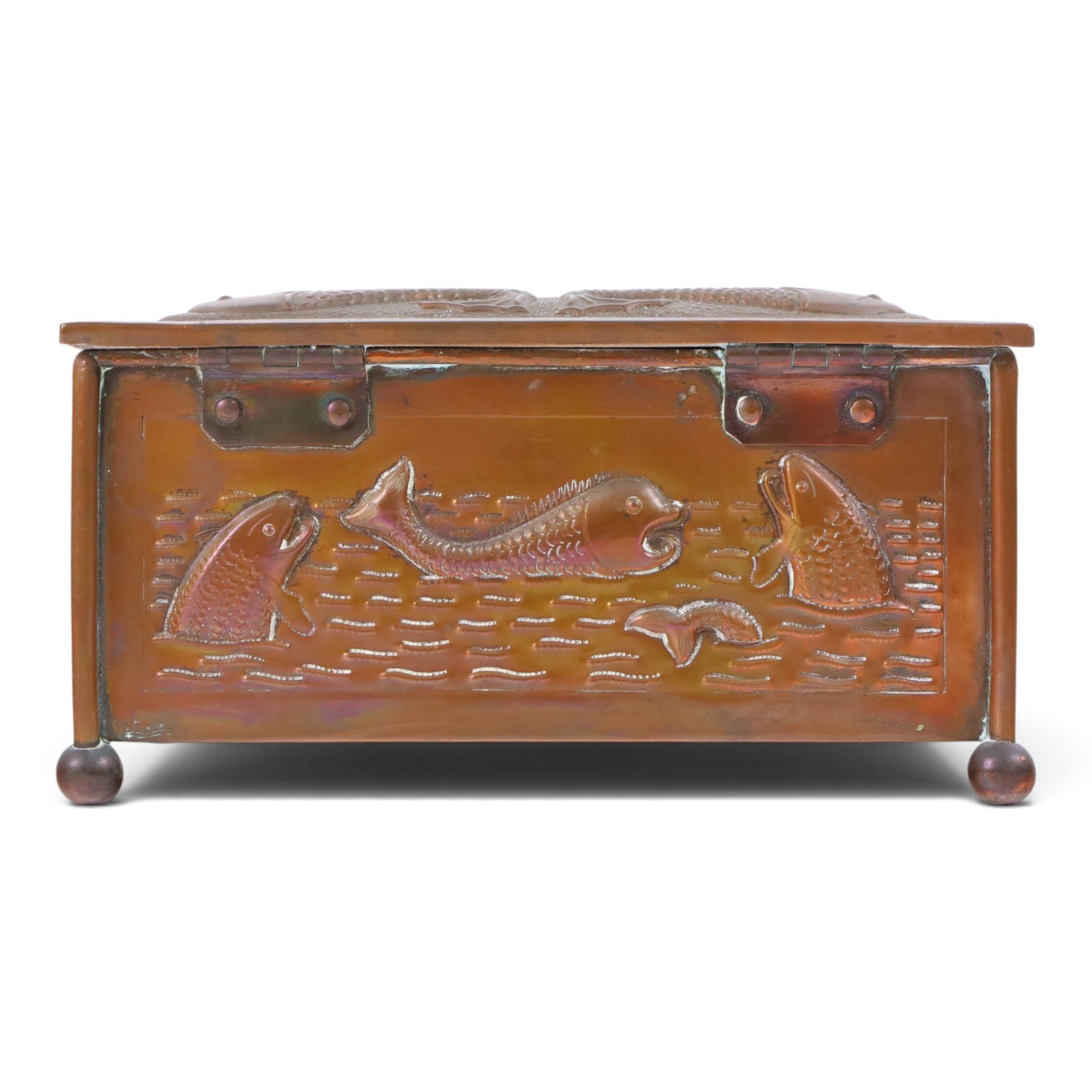 Art and Crafts copper and brass hammered casket, of rectangular form with repoussé decoration of dolphins, in the manner of  John Pearson, H10cm L19cm