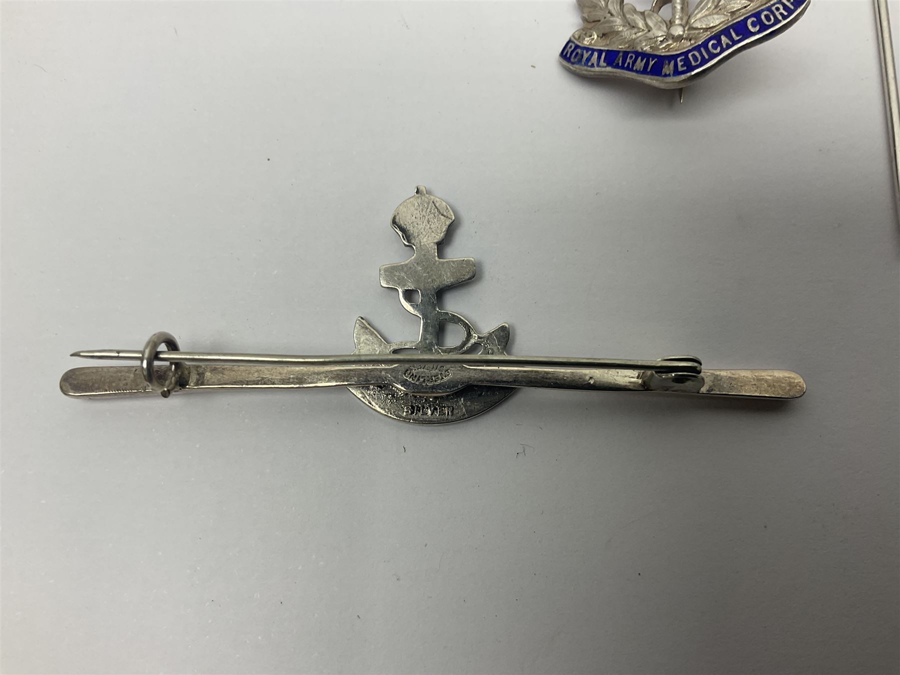 Five sterling silver sweetheart brooches - enamelled Royal Navy, enamelled RAMC, two graduated RAF and cultured pearl and paste flaming grenade stick-pin (5)