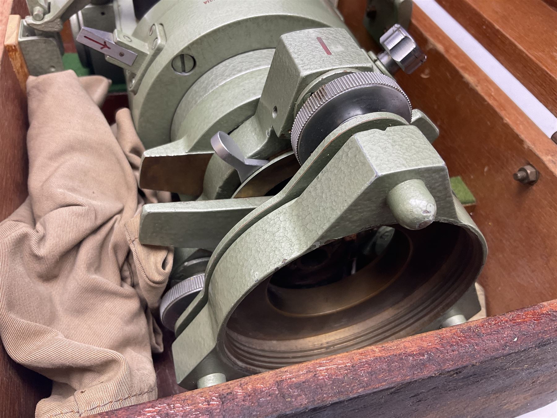 Vickers Instruments England Cooke V22 surveyor's theodolite, No.V.221387, with green enamelled body H32cm; in fitted wooden carrying box with retaining bar and repair label dated 3/8/77.
