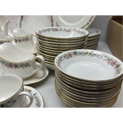 Royal Albert Paragon tea and dinner service for twelve decorated in the Belinda pattern, comprising fourteen saucers, twelve teacups, thirteen side plates, teapot, sauce boat and stand, salt and pepper shakers, two jugs, sucrier, twelve dinner plates, twelve smaller plates, two lidded tureens, twelve bowls, twelve smaller bowls, cake plate, oval plate and oval dish (100)