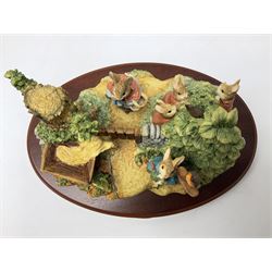 Four Border Fine Arts Beatrix Potter figures, comprising Tableau created to commemorate the Millenium together with a Border Fine Arts Limited Edition no 669814, The Tale of Peter Rabbit Tablet A1306, Four Little Rabbits A2442 and Sailing Home A2443