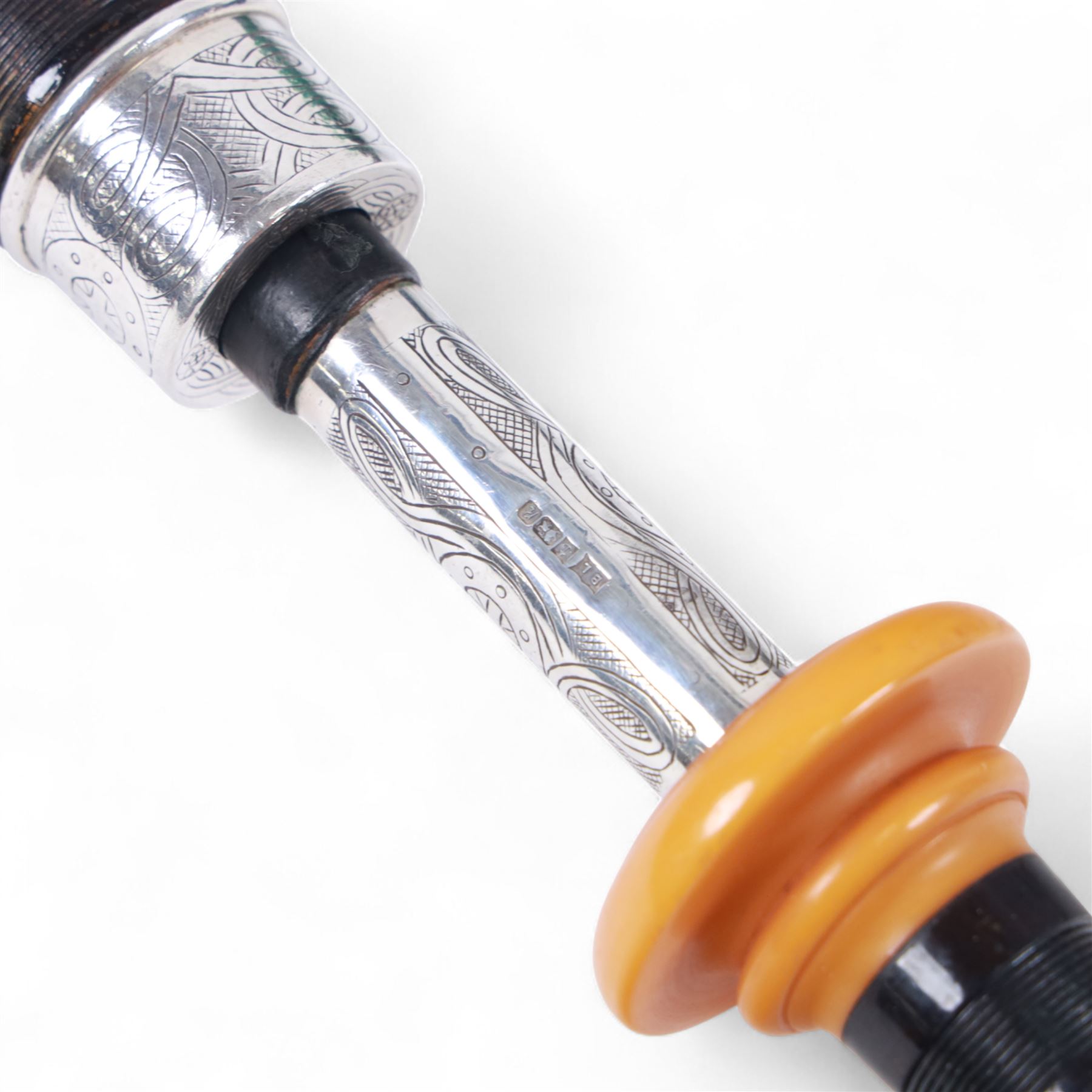 Set of late 20th century silver mounted bagpipes, the turned ebonised hardwood drone rods with Celtic knot and stipple engraved silver collars and ivorine mounts, hallmarked Bernie Leigh, Birmingham 1991, with R.G Hardie Glasgow plastic chanter and bag in green and blue Armstrong tartan, contained within a plush lined hard case, with a collection of spare reeds, drone rods, chanter, bags, cleaning accessories and other accessories 