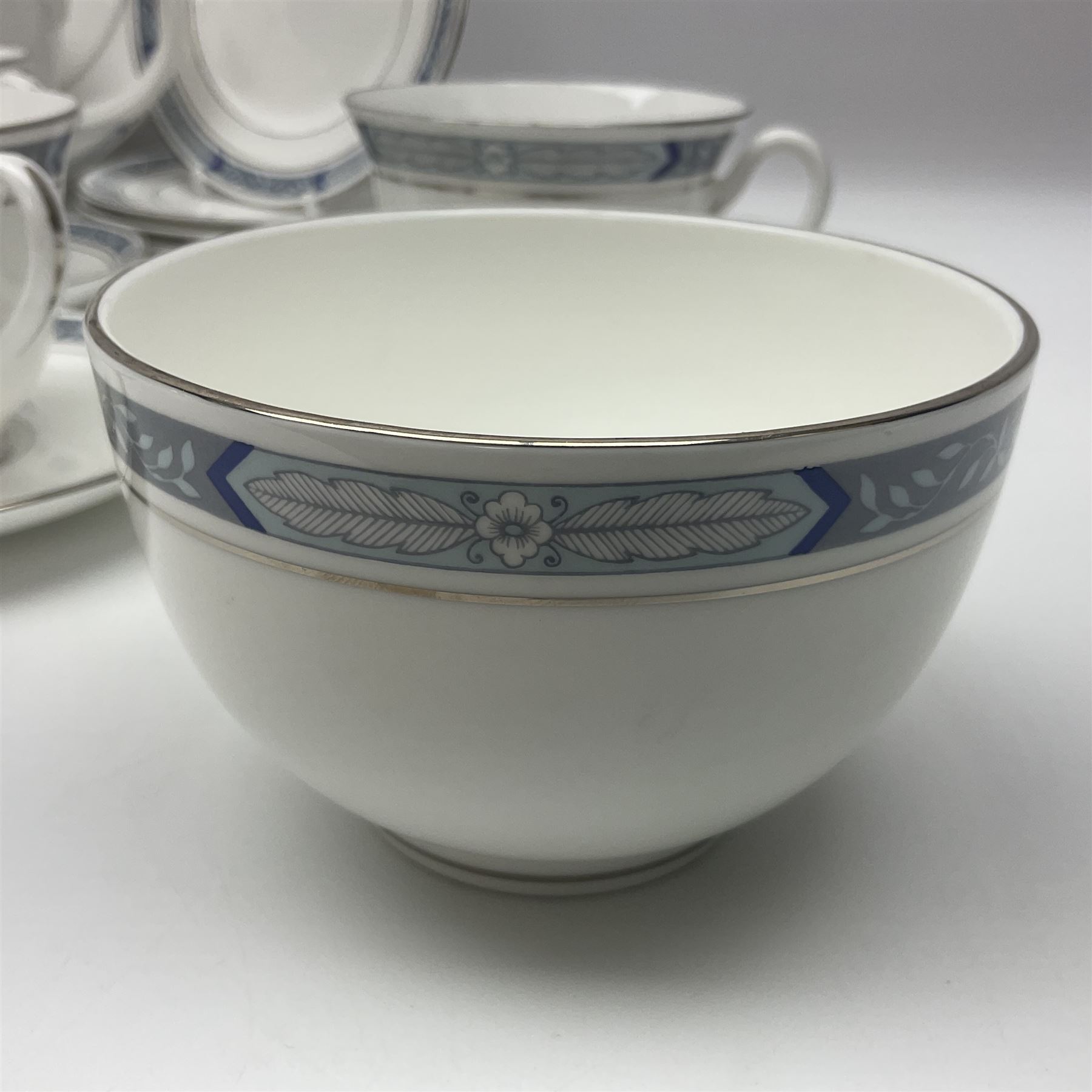 Royal Worcester Beaufort tea service, comprising teapot, milk jug, open saucier, eleven teacups, twelve saucers, eight dessert plates and one cake plate