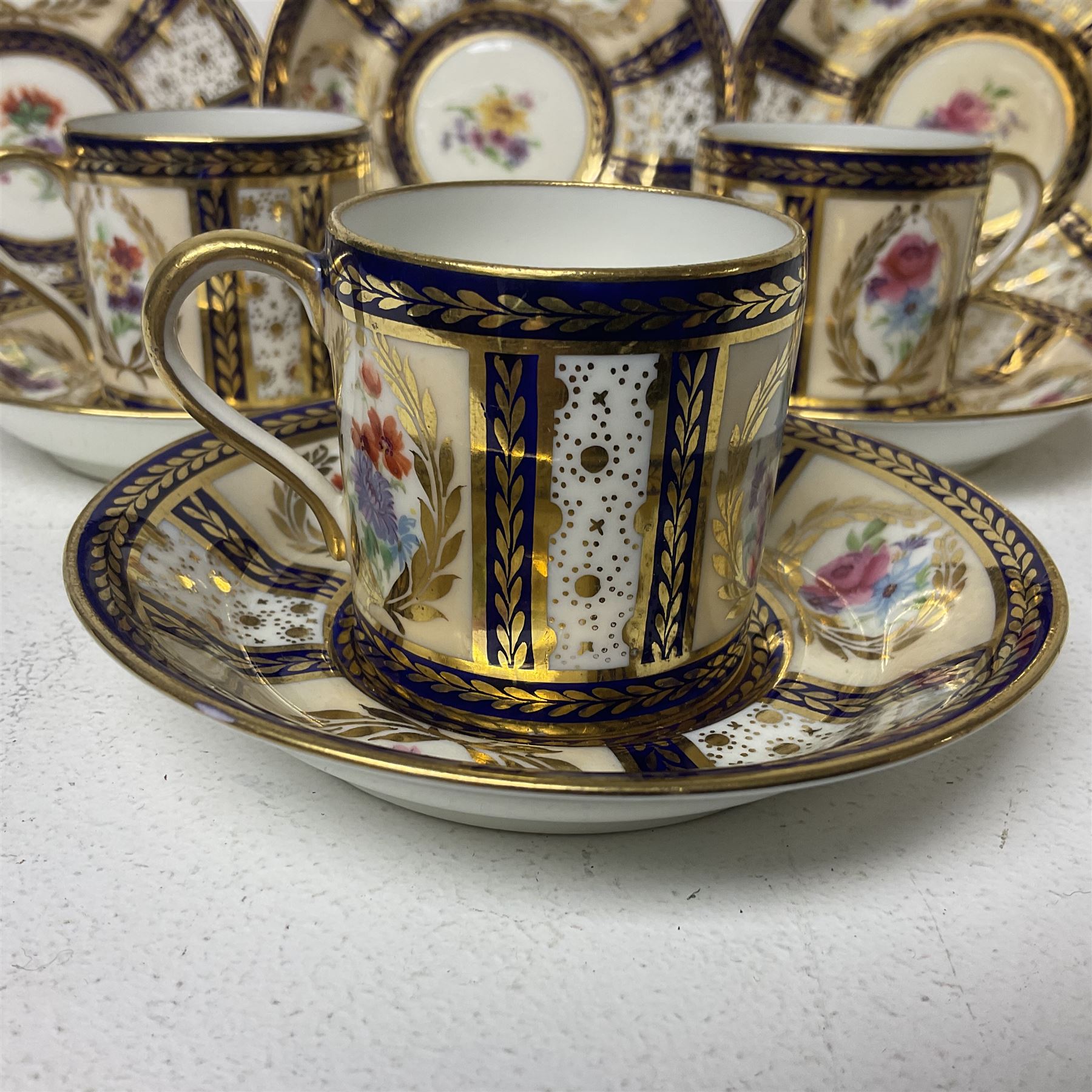 Paragon thee coffee cans and saucers, painted in gilt and colours with flowers, Paragon set of six coffee cups and saucers, 'Reproduction of Service accepted by Her Majesty Queen on her visit to the potteries, with three matching saucers