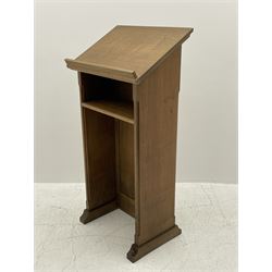 'Mouseman' oak lectern, sloped reading stand on panelled front, fitted with single shelf, sledge feet, by Robert Thompson of Kilburn