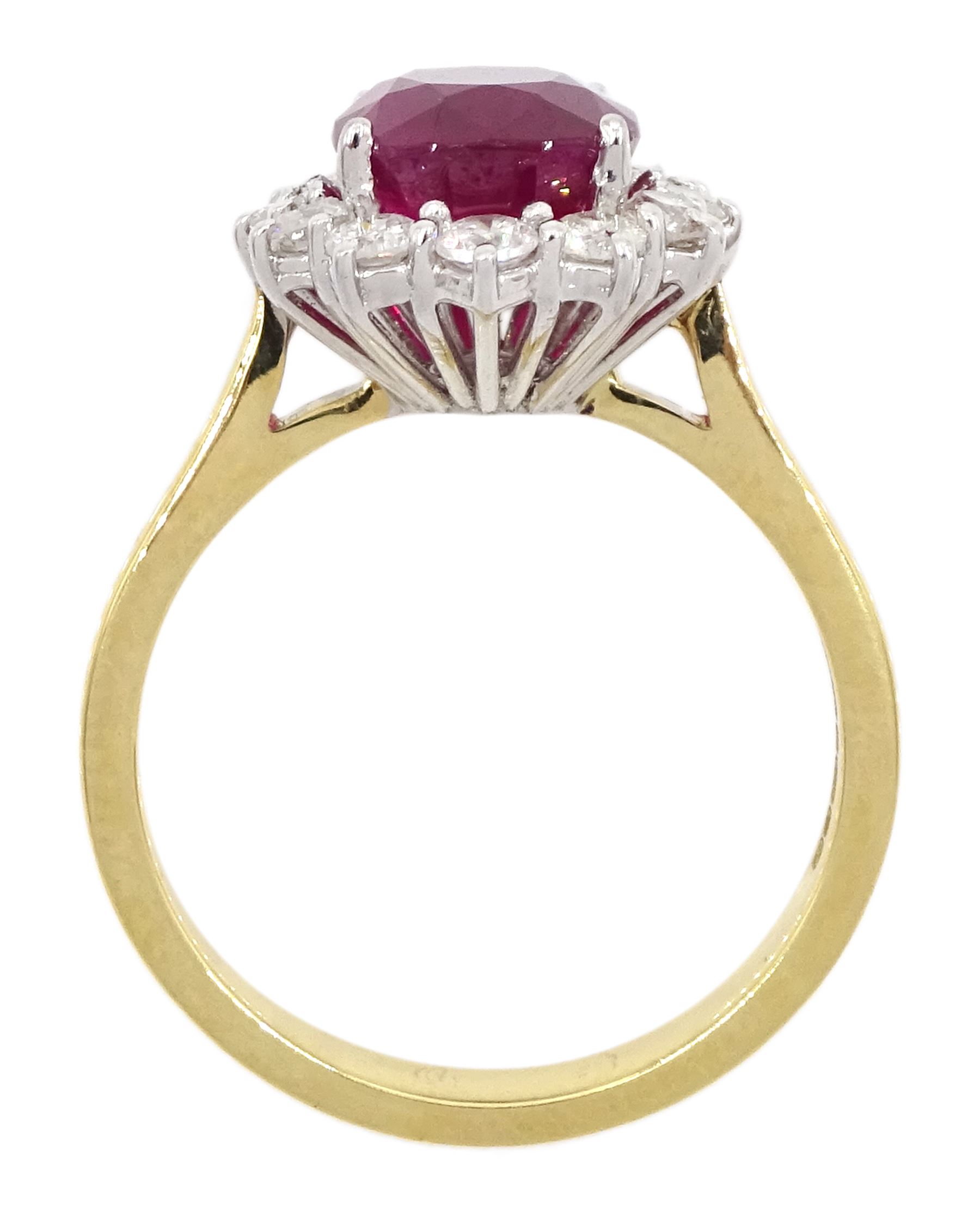 18ct gold oval cut ruby and round brilliant cut diamond cluster ring, hallmarked, ruby approx 3.40 carat, total diamond weight approx 0.65 carat