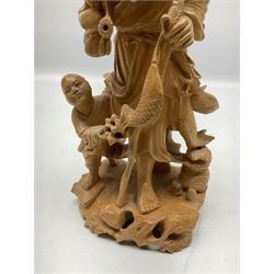 Two Japanese carved wood okimonos, to include example modelled as a fisherman holding his catch in one hand and pipe in the other, and his child, tallest H25cm