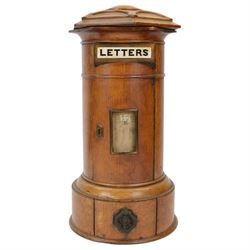Victorian oak Country House domestic post box, of cylindrical form with hexagonal moulded domed top above a rectangular posting aperture detailed 'LETTERS', and hinged door with glazed aperture for posting times, upon a circular plinth with pull our drawer and canted drop handle, overall H43cm