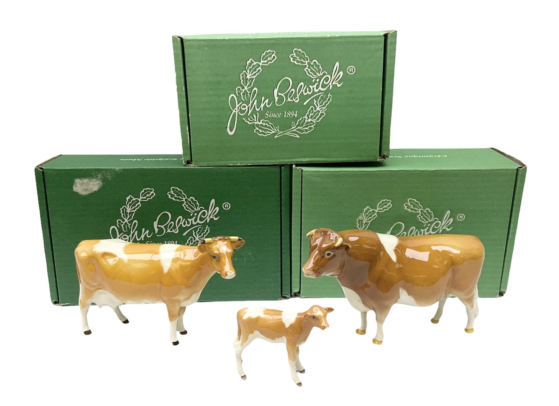 Beswick Guernsey cow family group, comprising bull 'Sabrina's Sir Richmond' no 1451, cow no 1248a and calf no 1249a, all with printed mark beneath and with original boxes 