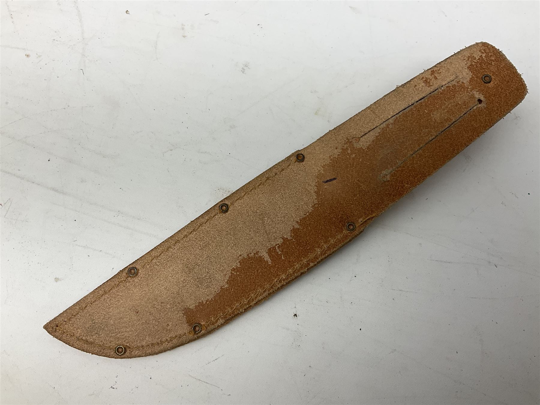 Graduated set of three Bowie knives by J. Nowill & Sons Sheffield England Est. AD1700, each with steel blade, brass cross-piece, stacked leather type grip and alloy pommel; largest blade 13cm and smallest 7.5cm; each in leather sheath (3)