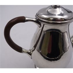 Liberty & Co 1930s small silver coffee pot, of plain baluster form, with brown Bakelite C handle with trefid mounts and cover with spherical knopped finial, upon circular stepped foot, hallmarked Liberty & Co, Birmingham 1934