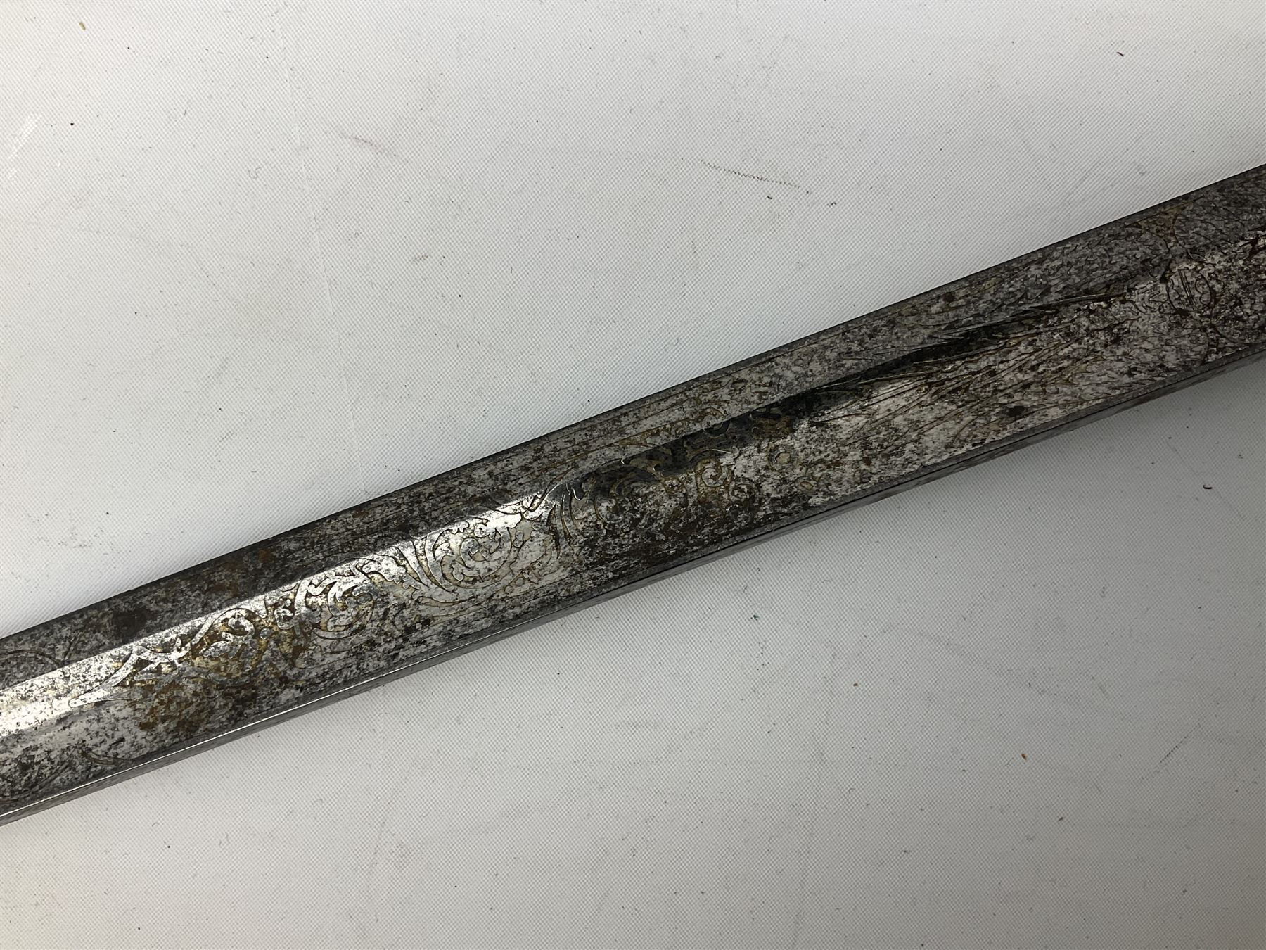 Victorian artillery officer's sword, the 90cm fullered steel blade by E. Thurkle Denmark Street Soho London decorated with Victoria cypher, Regimental crest and 'Royal Artillery', three-bar hilt with stepped pommel and wire-bound fish skin grip; in leather covered scabbard L107cm overall