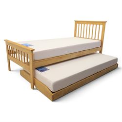 Contemporary light oak trundle bed, slatted headboard and footboard,  incorporating pull-out trundle bed on castors, complete with two memory foam mattresses