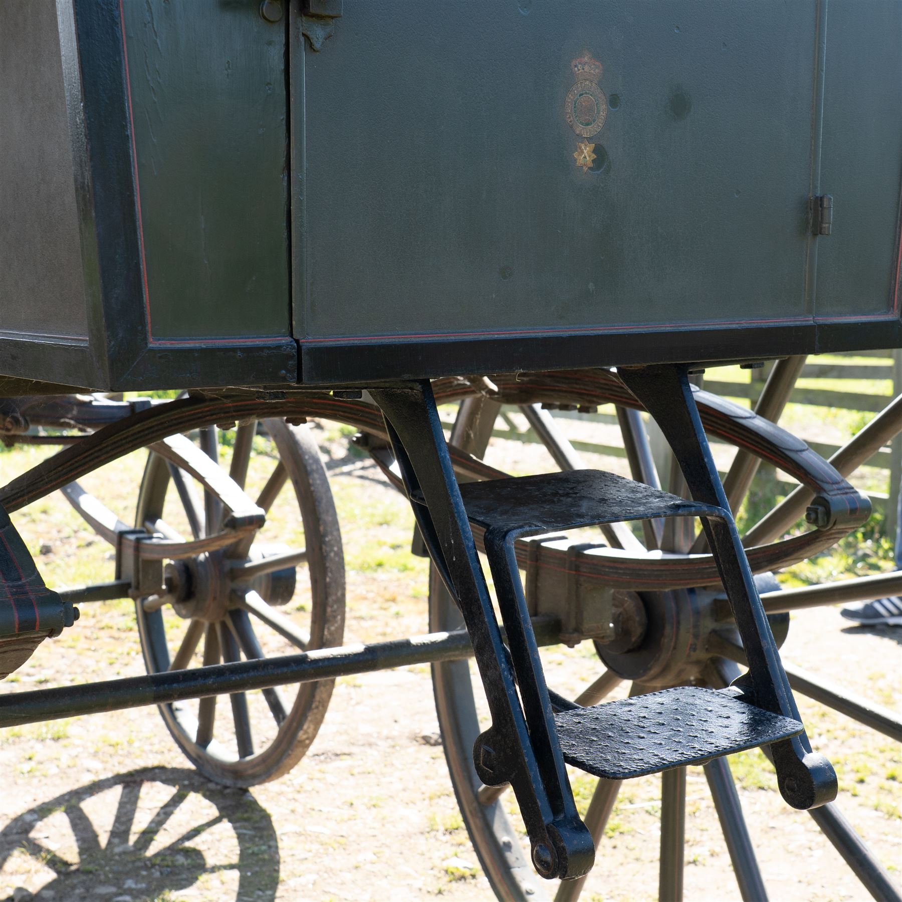 The Zetland Body Break by Peters & Sons, London

A fine and substantial late nineteenth century body break by Peters & Sons of London, circa 1880, formerly owned by the Marquis of Zetland. The carriage is finished in dark olive green and black with red, black and yellow lining, and is fitted with an elevated coachman’s box seat above a forward luggage compartment. The open rear body is entered by side doors and arranged with opposing longitudinal passenger seating.

The carriage is mounted on English pattern wooden artillery wheels with iron tyres and is carried on full elliptic springs, with a transverse helper spring behind. The front axle is fitted with fifth wheel turntable steering. The rear passenger compartment has upholstered longitudinal side benches beneath padded back rails, with turned spindle upper panels to the side doors and rear handrails. The driver’s seat is upholstered in corded fabric and secured with leather retaining straps.

Details include shaped splinter bar and turntable, folding rear step below the door with leather covered interior handle, luggage rails to either side, pole fittings for use with a pair or team of horses, and a handbrake with brake blocks operating to both rear wheels. The wheel hubs are fitted with polished hub caps engraved “Peters & Sons, London”. The exterior retains small Zetland family crests to the side panels.

The carriage has been conserved by Woods of Fairbourne Carriages Ltd and is recorded as Lot 146 in The George Shaw Collection sale, 5 November 2003, where it was catalogued as The Zetland Body Break and described as having previously been owned by the Marquis of Zetland.

Features
• Peters & Sons, London coachbuilder’s hub caps
• Known as The Zetland Body Break
• Formerly owned by the Marquis of Zetland
• Circa 1880
• Conserved by Woods of Fairbourne Carriages
• Dark olive green and black bodywork with red, black and yellow lining
• Elevated coachman’s box seat
• Forward luggage compartment
• Open rear passenger body with side doors
• Opposing longitudinal passenger seating
• Turned spindle upper panels to the side doors
• Folding rear step with leather covered interior handle
• Full elliptic spring suspension with transverse helper spring behind
• Fifth wheel turntable steering
• Handbrake with brake blocks operating to both rear wheels
• Wooden artillery pattern wheels with iron tyres
• Shaped splinter bar and pole fittings for a pair or team of horses
• Small Zetland family crests to the side panels

Provenance
The George Shaw Collection, 5 November 2003, Lot 146. Previously owned by the Marquis of Zetland.

Conservation

Conserved by Woods of Fairbourne Carriages.

Dimensions:
Overall length: 310 cm
Width: 176 cm
Height: 226 cm

Front wheel diameter: 98 cm
Rear wheel diameter: 140 cm

Seating:
Driver's box seat: 2 persons

Rear passenger compartment: Two longitudinal benches accommodating approximately 8 to 10 passengers