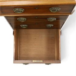 Late Victorian mahogany desk with red leather top, rectangular top with inset toold red leather writing surface, central long frieze drawer flanked by two short drawers, above pedestal with three graduating drawers with ring pull handles, on moulded plinth bases raised on castors