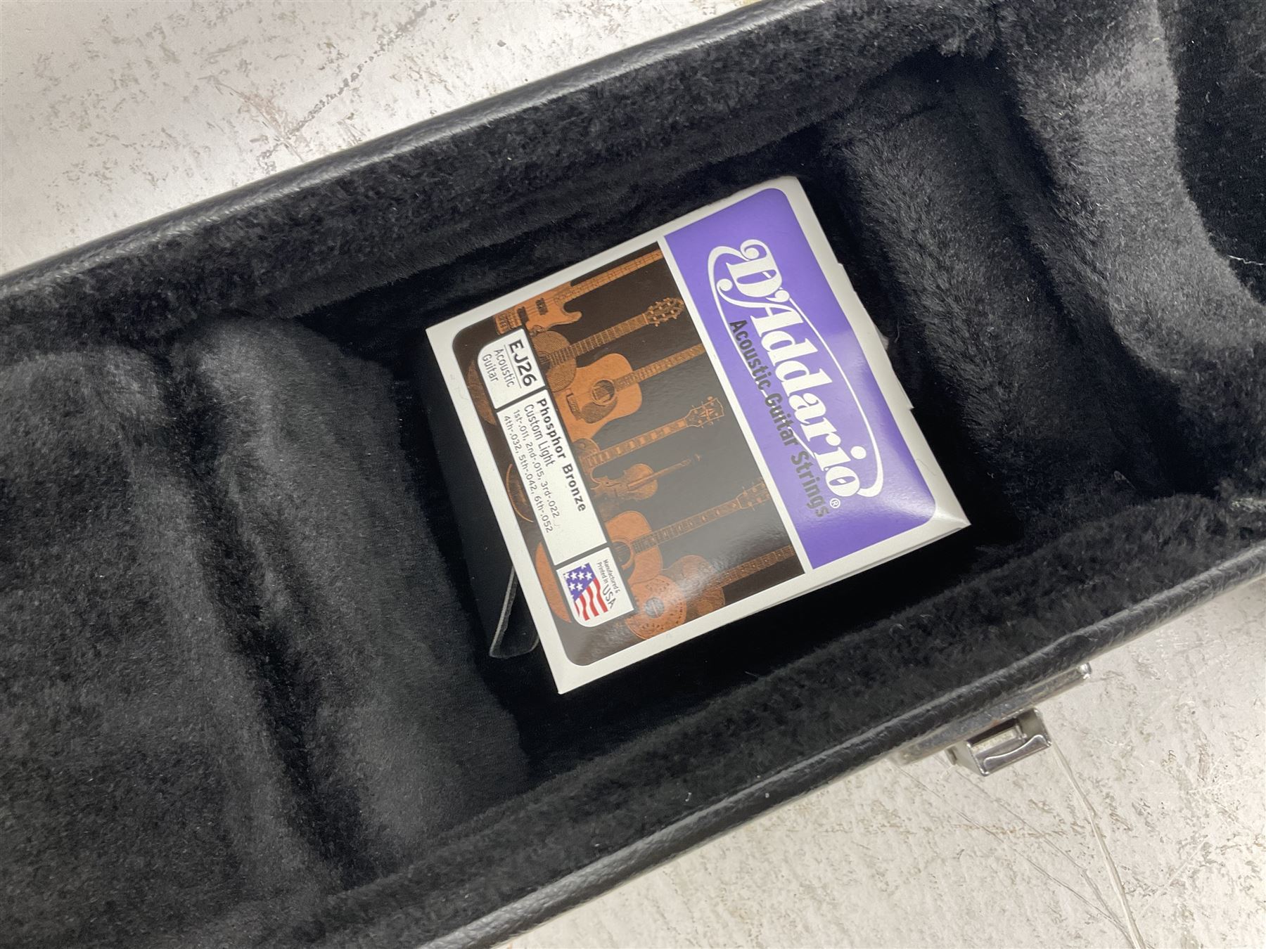 Ozark metal cased resonator guitar with all over chased foliate decoration to the polished finish and mother-of-pearl inlay to the fretboard L100cm; in Stagg hard carrying case