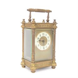 Edwardian-French 8-day timepiece carriage clock in an ornate case with reeded pilasters an...