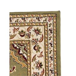 Turkish Sincerity Royale green ground rug, the field decorated with a central floral medallion surrounded by scrolling floral motifs in shades of cream, beige, and burgundy, spandrels filled with matching floral designs, the border featuring a series of floral patterns on a cream ground, finished with green edges