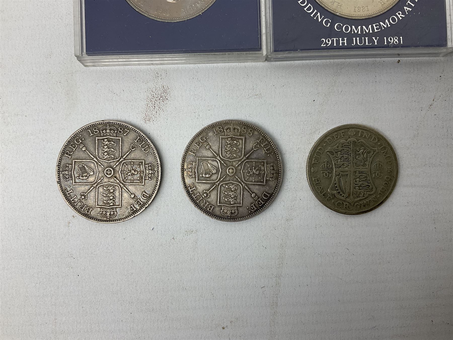 Great British and World coins including Queen Victoria 1887 and 1888 double florins, King George V 1929 halfcrown, King George VI 1951 Festival of Britain crown, commemorative crowns, Queen Elizabeth II 1953 nine coin set in blister pack, 1989 and 1995 two pound coins, various pre-decimal pennies and other coinage