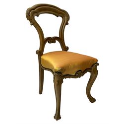 Pair of Victorian walnut side chairs, shaped cresting rail carved with acanthus leaves, overstuffed upholstered seats with stud band, on cabriole supports with scroll carved terminals