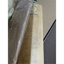 Two signed cricket bats, with signatures including Colin Cowdrey