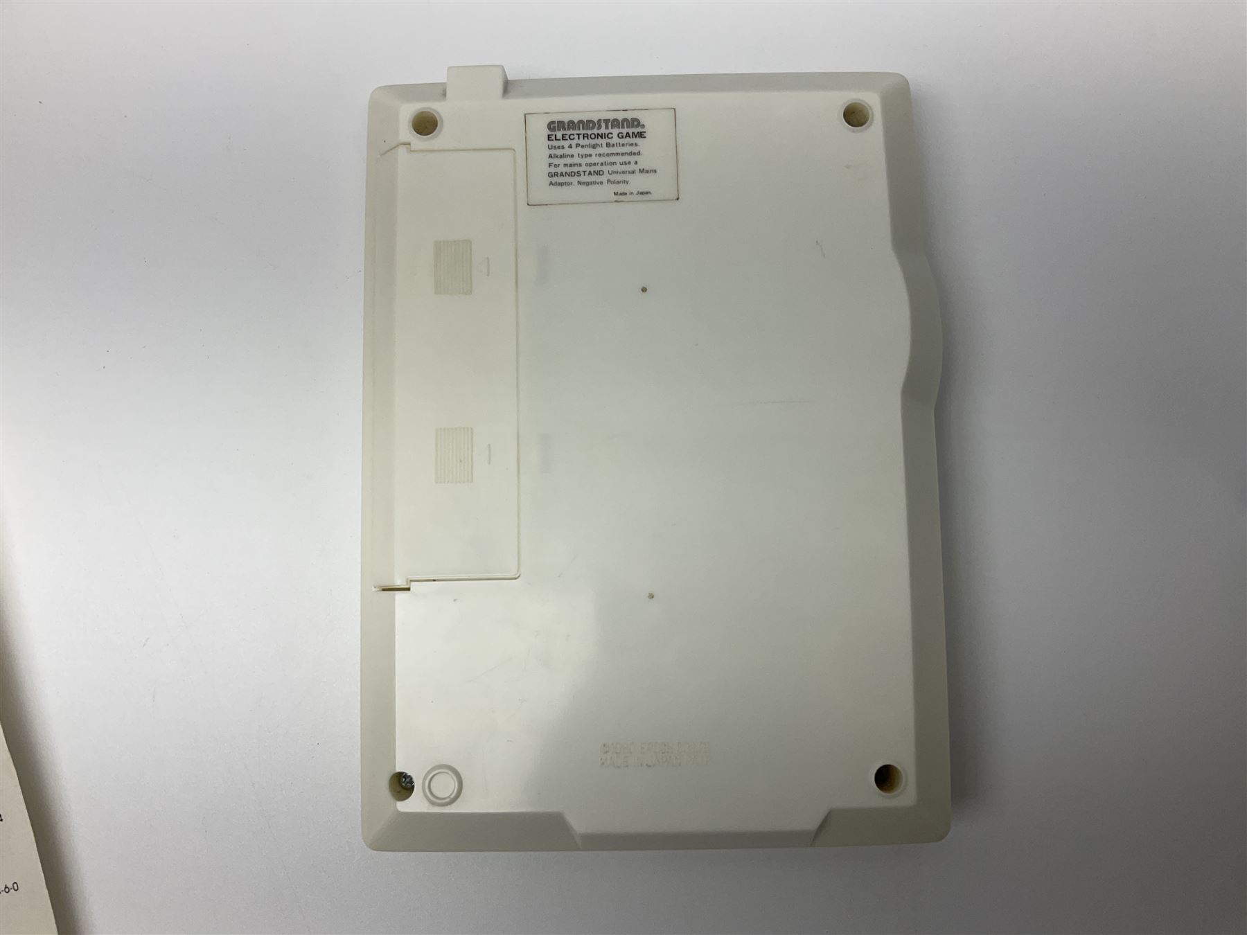 Three late 70s/early 80s handheld electronic games; Bandai Electronics Arcade ‘Gunfighter’ (1980), Grandstand ‘Invader From Space’ (1980), Palitoy ‘Merlin The Electronic Game Machine’ (1979) with game sheet and instruction booklet, all with original boxes (3) 