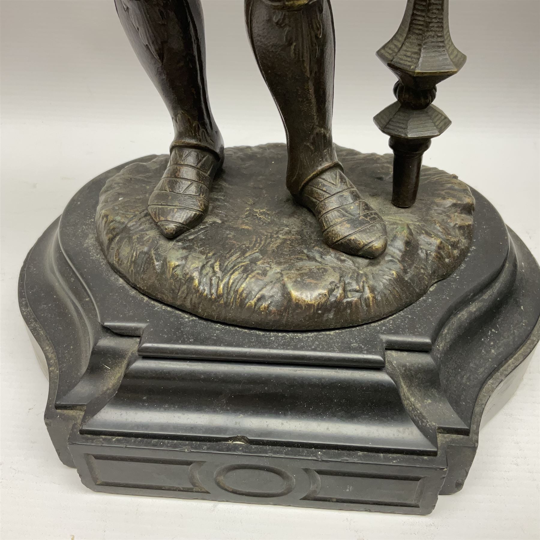 Pair of bronzed figure modelled as a hunter in traditional dress, each holding a pike, H48cm