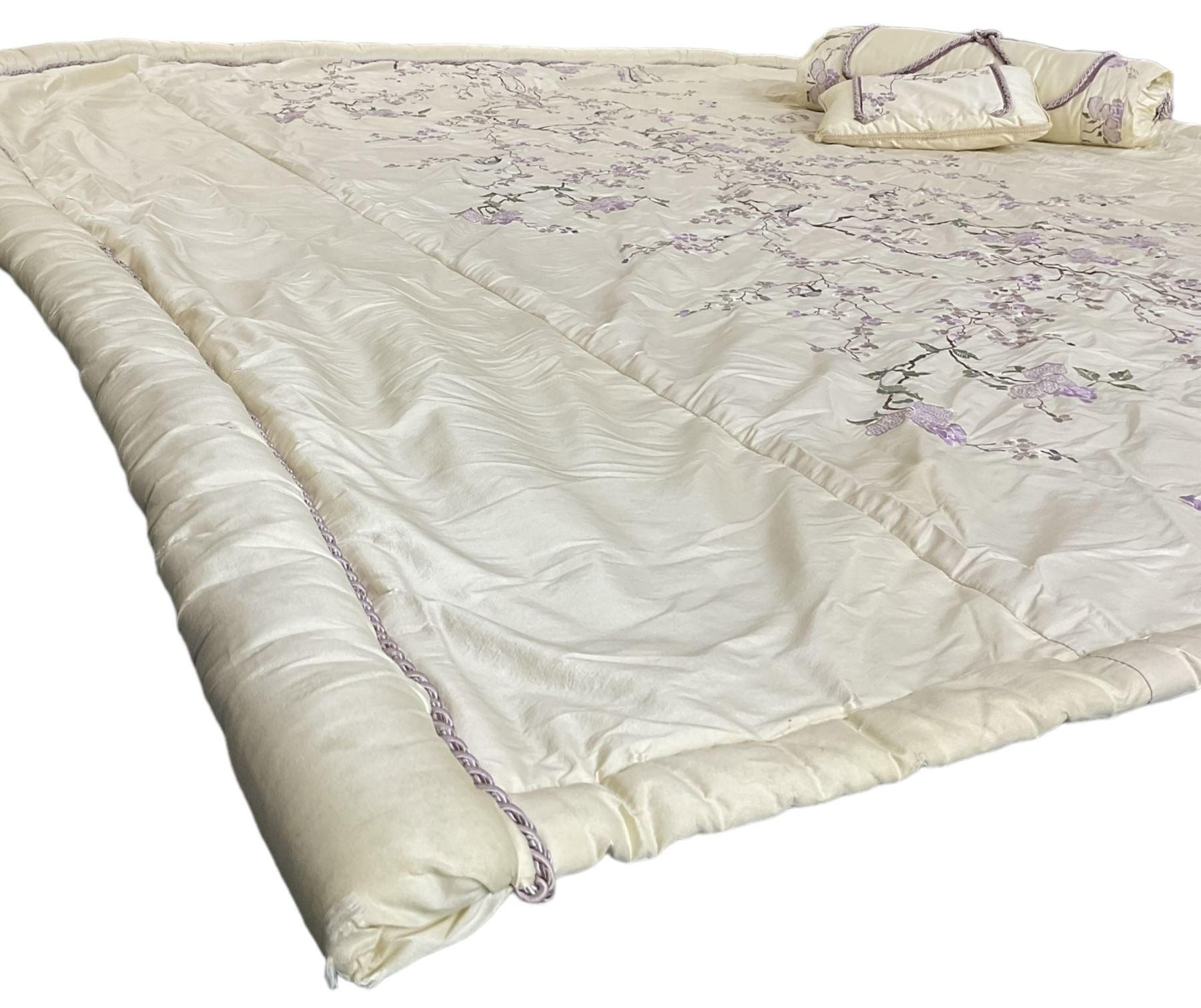 5' Kingsize headboard with stepped arch cresting, upholstered in cream silk with raised stitching decorated with trailing foliage branches and birds; matching bedspread (251cm x 218cm); two matching cushions  