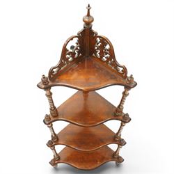 Victorian mahogany corner four-tier whatnot, shaped shelves with pierced and turned uprights, raised on turned supports