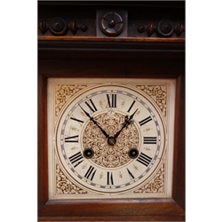  Victorian walnut architectural cased mantel clock, square dial marked Junghans, twin train movement striking the hours on a gong, H50cm   